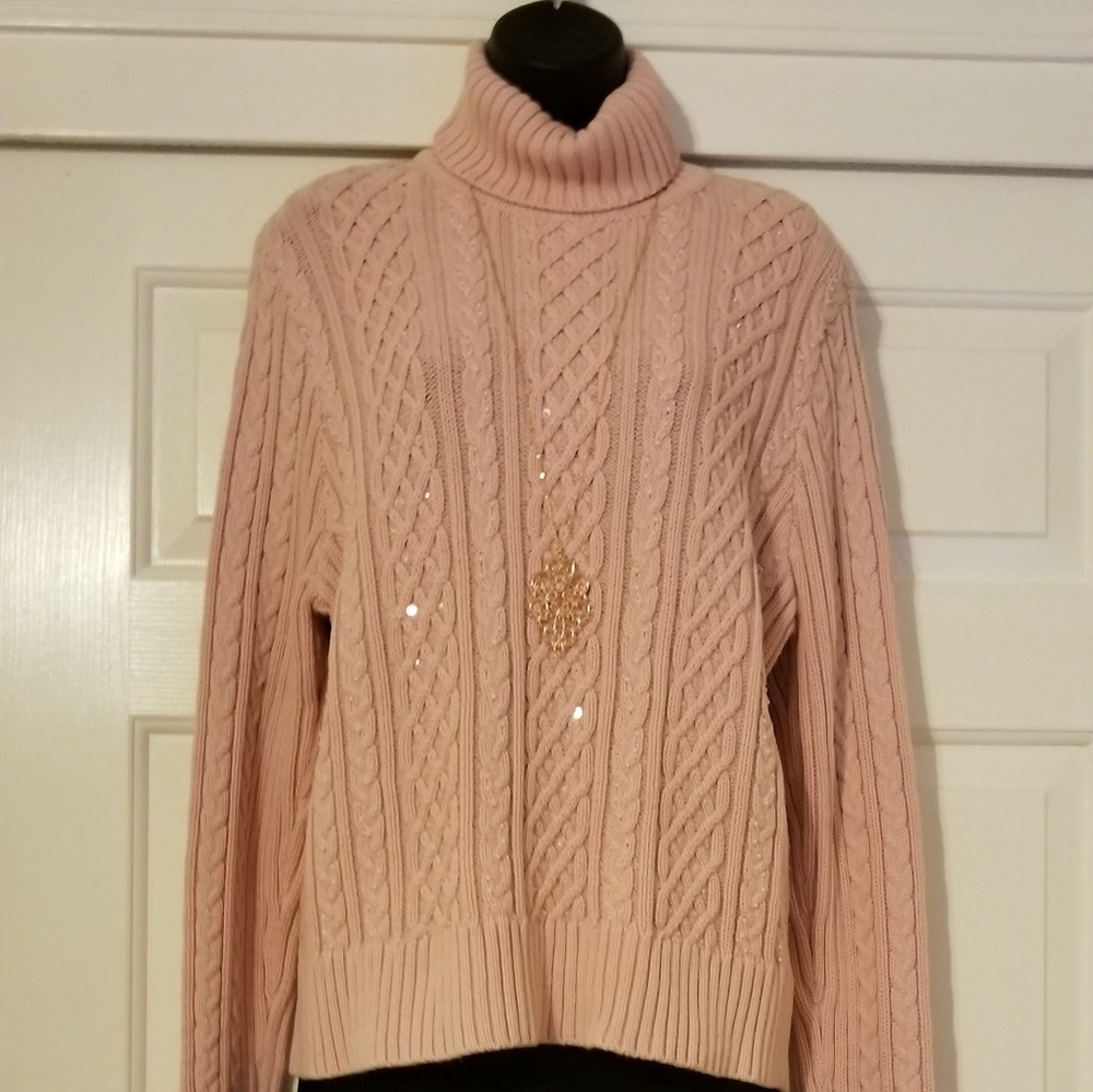 Pink sweater embellished with pearls